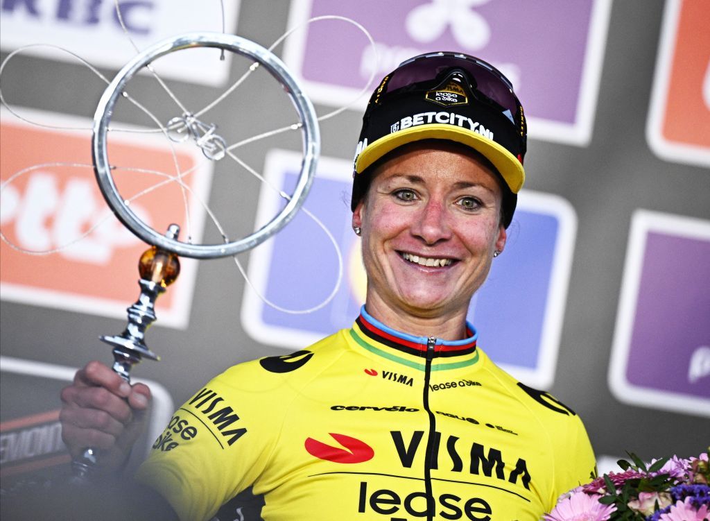 Dutch Marianne Vos of Team Visma-Lease a Bike celebrates on the podium after winning the women's one-day cycling race Omloop Het Nieuwsblad (UCI World Tour), 127,1km from Gent to Ninove, Saturday 24 February 2024.
BELGA PHOTO JASPER JACOBS (Photo by JASPER JACOBS / BELGA MAG / Belga via AFP)