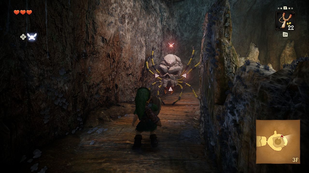 Link approach a Skulltula that hangs from the ceiling in The Legend of Zelda: Ocarina of Time remake, a spider enemy with a skull body who is larger than Young Link himself