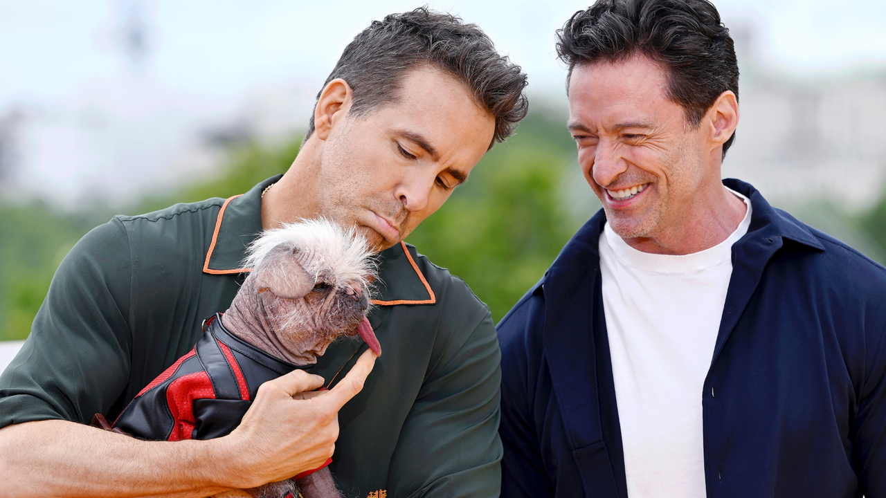 Ryan Reynolds, Peggy aka Dogpool the “UK’s Ugliest Dog Winner” and Hugh Jackman attend the photocall for &quot;Deadpool &amp; Wolverine&quot; at the IET Building, Savoy Place on July 12, 2024 in London, England.