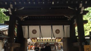 The entrance to a rustic, brown Japanese temple