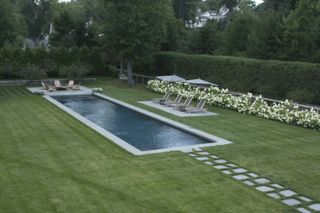 pool landscape ideas with planting concealing the fencing
