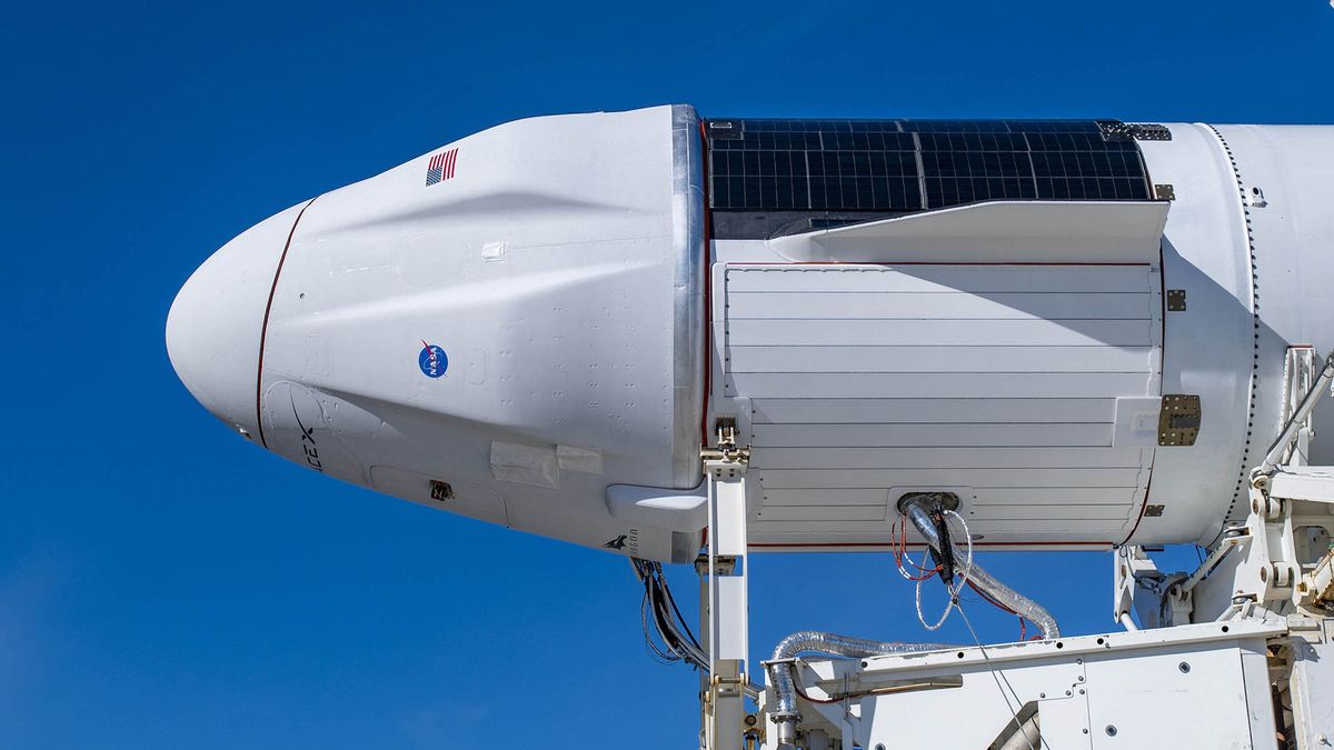 The upgraded version of SpaceX's Cargo Dragon spacecraft is seen atop a Falcon 9 rocket on Dec. 2, 2020, as they prepare to be rolled out to Launch Complex 39A at NASA's Kennedy Space Center in Florida for the company's 21st Commercial Resupply Services (CRS-21) launch.