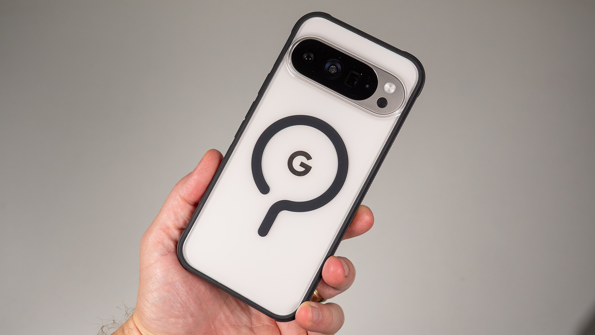 A Dbrand Ghost 2.0 case on a white Google Pixel 10 Pro XL