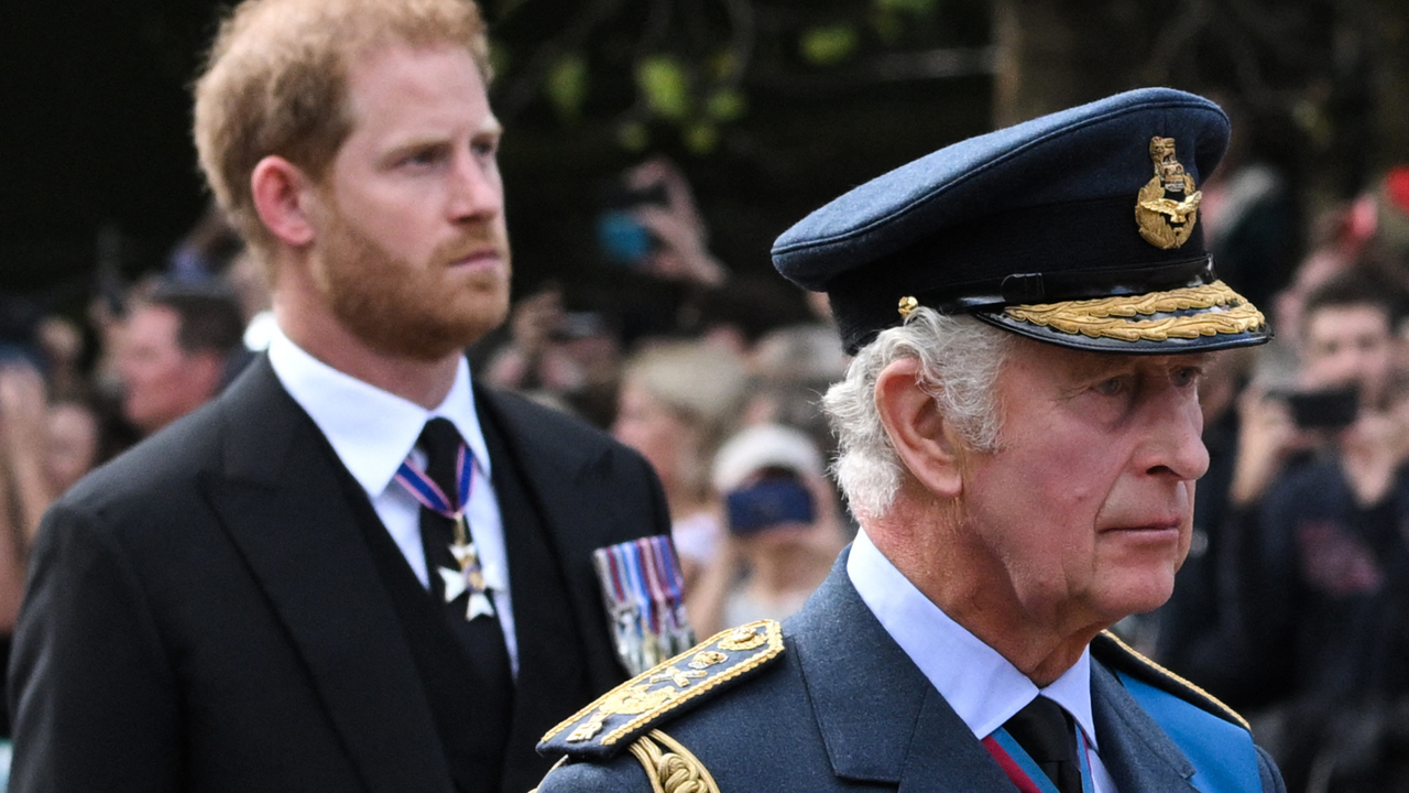  Britain&#039;s King Charles III and Britain&#039;s Prince Harry, Duke of Sussex walk behind the coffin of Queen Elizabeth II, adorned with a Royal Standard and the Imperial State Crown and pulled by a Gun Carriage of The King&#039;s Troop Royal Horse Artillery, during a procession from Buckingham Palace to the Palace of Westminster, in London on September 14, 2022.