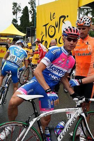 Cunego climbs on his machine