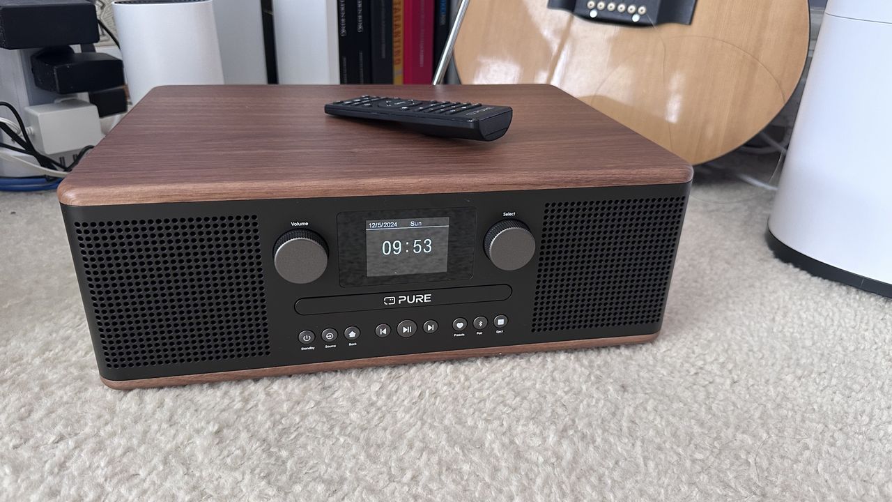 Pure Classic C-D6 DAB/FM Radio, CD player, Blueetooth speaker with a remote control on a carpet