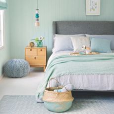 best colour combinations, aqua and pale blue bedroom with grey bed, blond wood bedside, aqua throw, artwork, pendant light, rug, pale blue knitted footstool, basket 