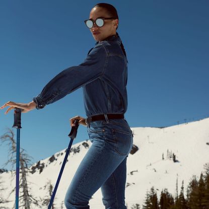 model on the mountains wearing levi's denim