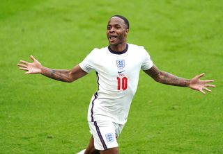 Raheem Sterling celebrates scoring the first goal of the game for England