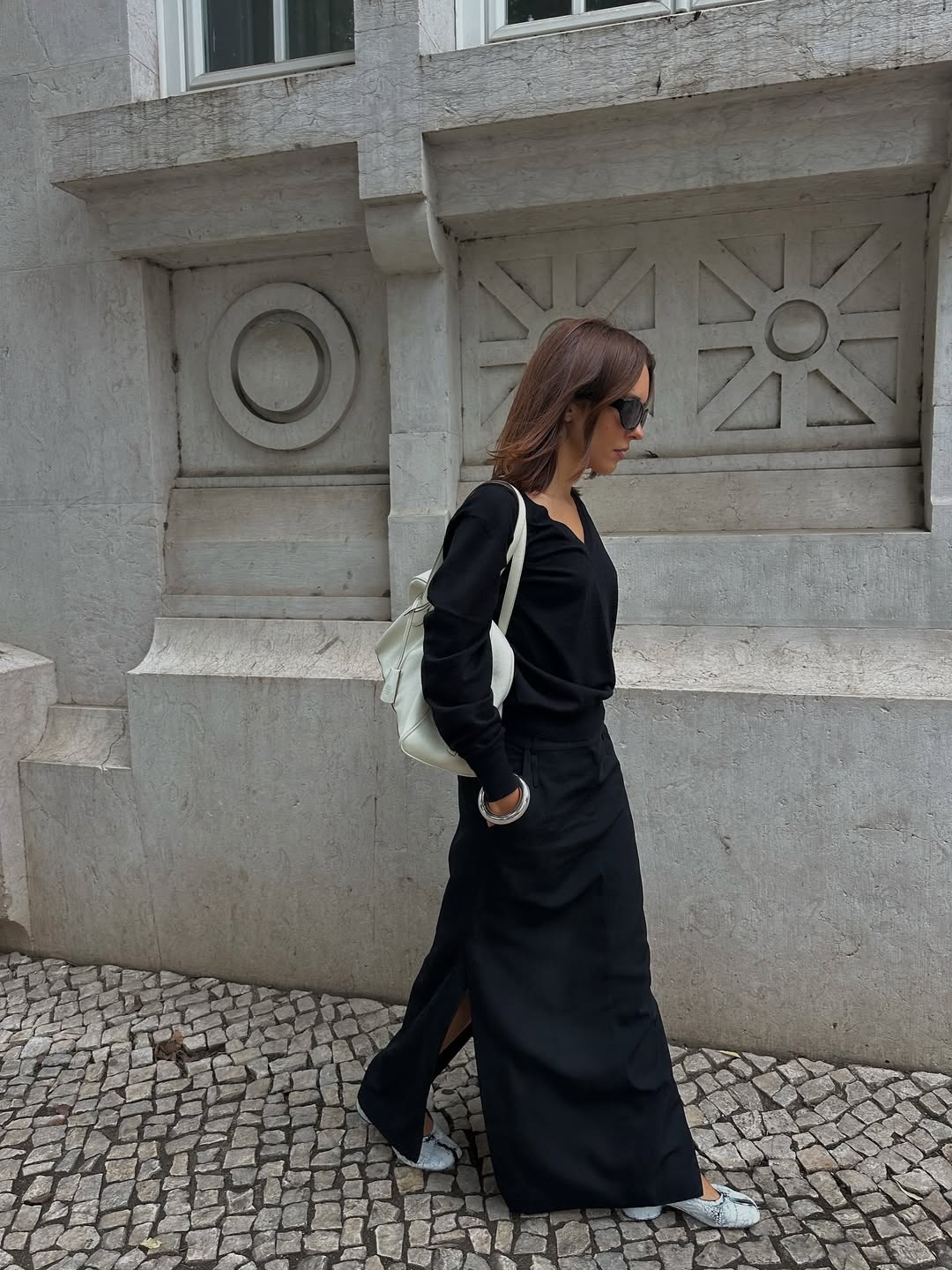 Woman wears Maison Margiela Tabi heels on the street