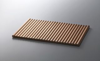 A rectangular tray with individually segmented sections next to each other.
