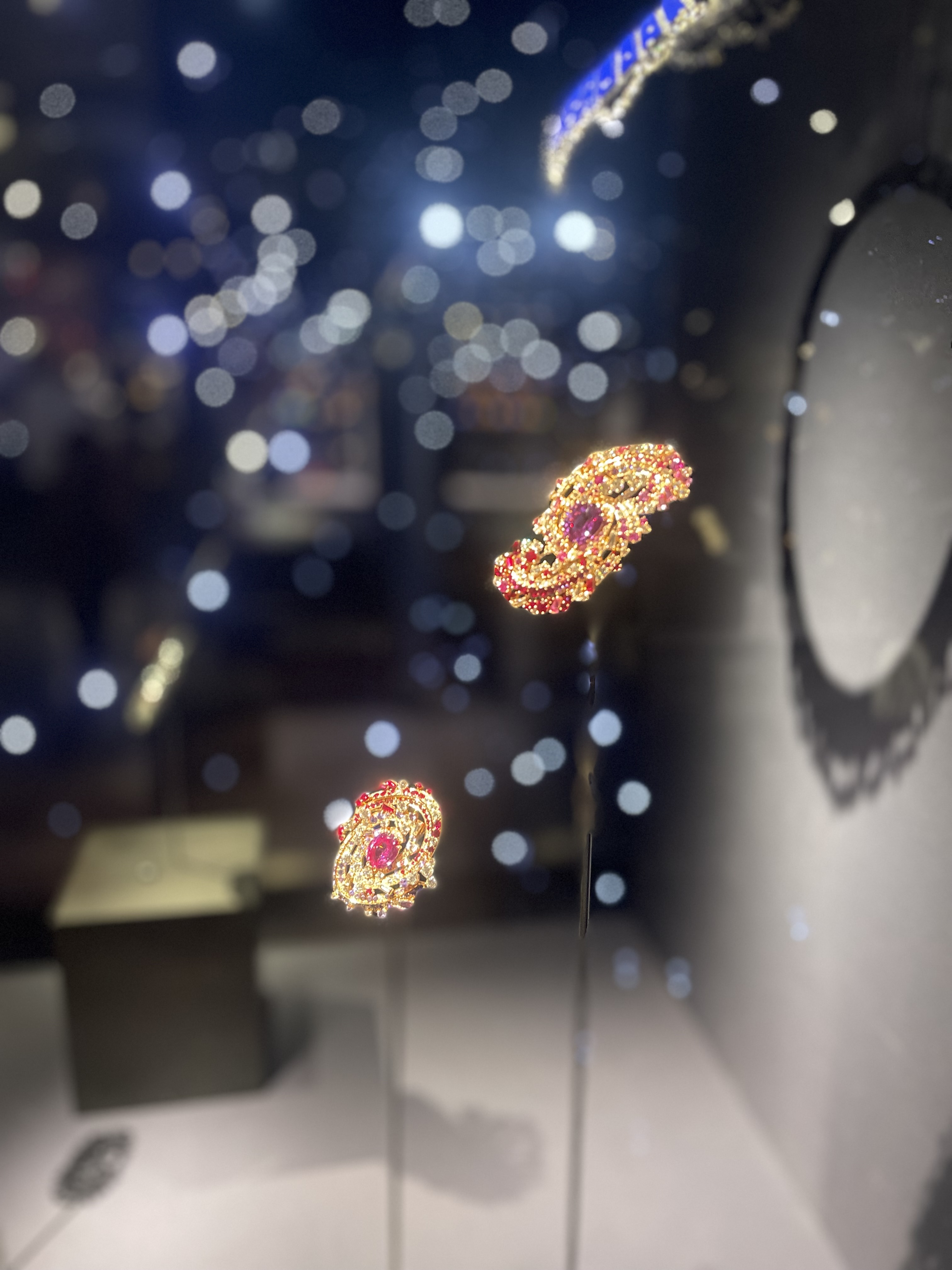 Two pendants with pink stones.