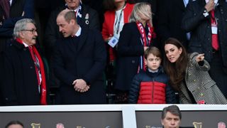 Catherine, Duchess of Cambridge speaks to Prince George prior to the Guinness Six Nations Rugby match
