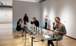 In the adjacent 'salon' a glass table holds the same perfumes in liquid form, into which visitors can dip blotters.