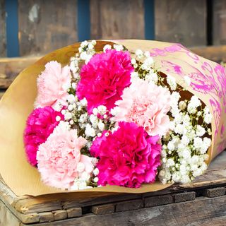 carnations wooden table with blur background