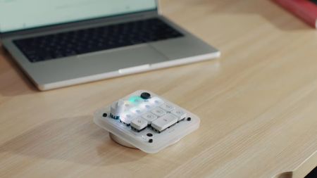 Codex Micro keypad in front of a laptop