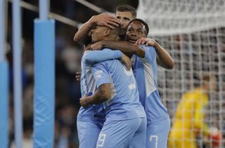 Manchester City players celebrate their sixth goal against RB Leipzig in the Champions League in September 2021.