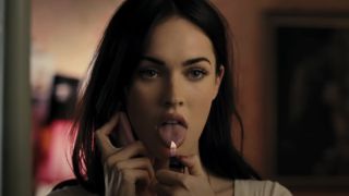Megan Fox's Jennifer holding a lighter flame up to her tongue in Jennifer's Body