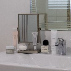 Bathroom sink with beauty products 
