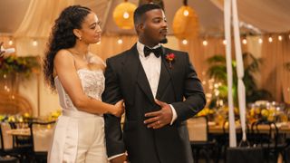 Samantha Logan as Olivia Baker and Daniel Ezra as Spencer James embraced at their wedding reception in All American season 6 finale