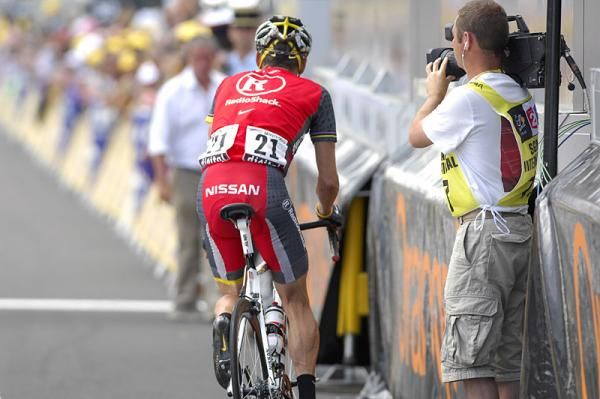Lance Armstrong (RadioShack) turns around on the finish line and heads back down the race route.