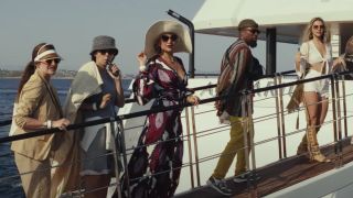 Members of Knives Out 2's main cast walking up to a boat