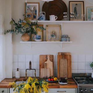 Kitchen with open shelves and greenery