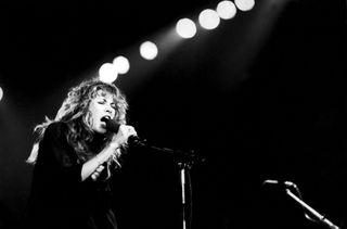 Stevie Nicks performing live on stage.