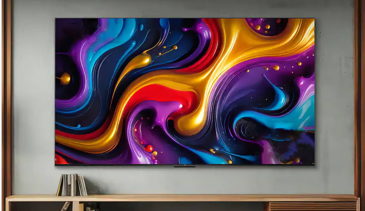 The TCL Q55K 98-inch QLED TV on a wall.