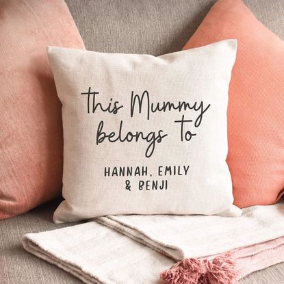 Manta Makes Personalised This Mummy belongs to Cushion on grey sofa with other pink cushions