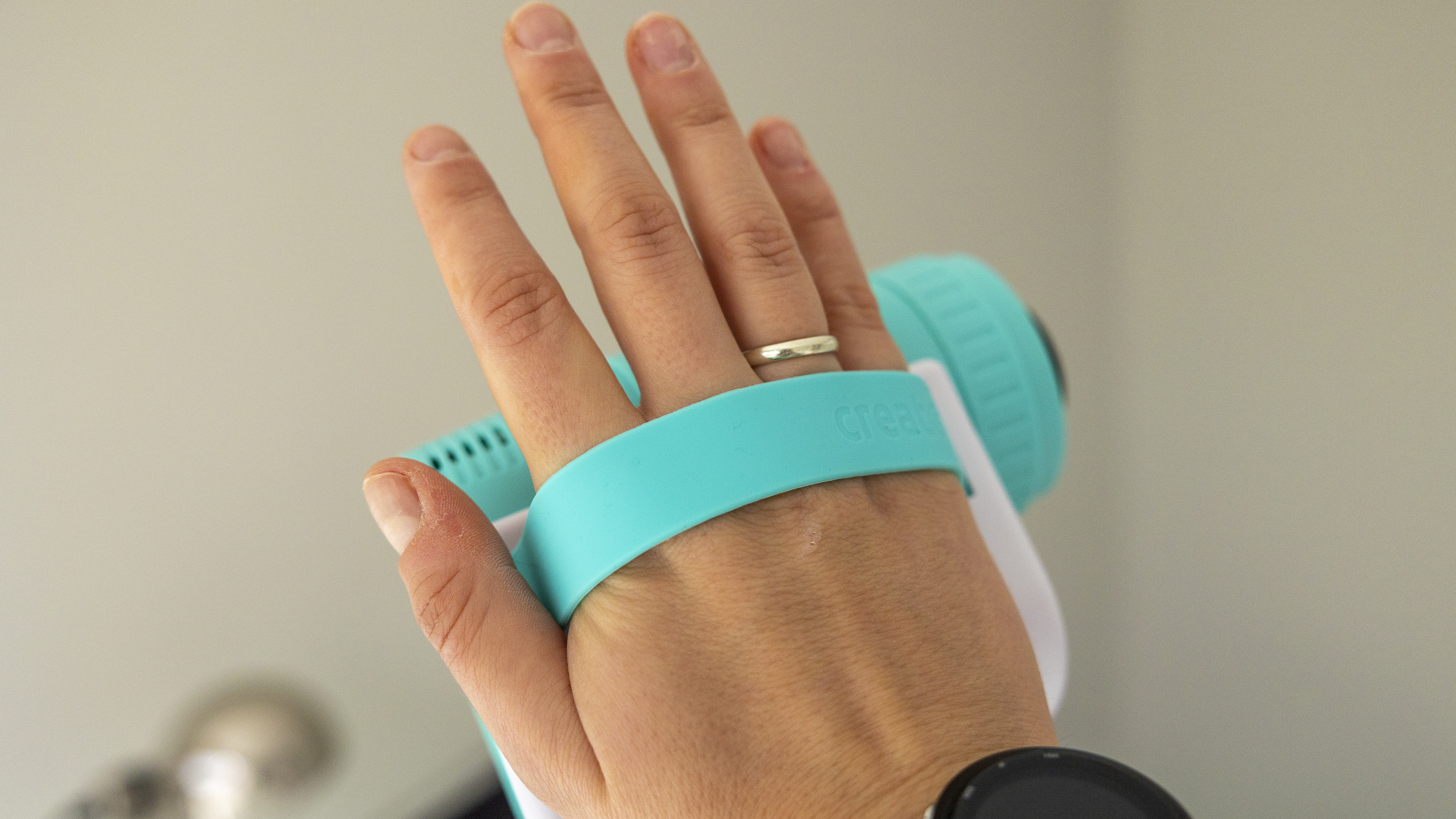 The Photo Creator projector video camera being handled in a home office