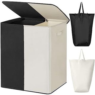 A split laundry hamper, one side black, one side white, with two removeable bags shown beside. 