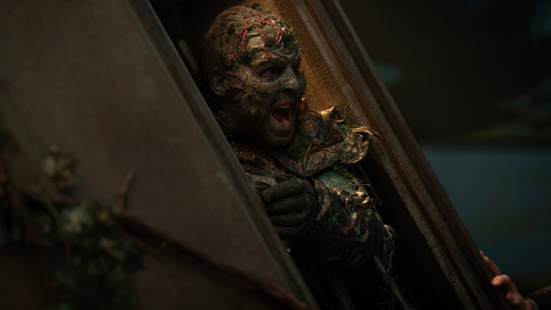 A screaming zombie busting out a door. Scene from season 3 , Episode 3 of Strange New Worlds streaming on Paramount+.