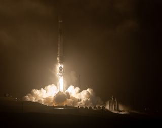 NASA's Double Asteroid Redirection Test, or DART, launches atop a SpaceX Falcon 9 rocket from Vandenberg Space Force Base in California, at 1:21 a.m. EST (0621 GMT) on Nov. 24, 2021.