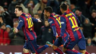 Lionel Messi celebrates with Rafinha and Neymar after scoring the winner for Barcelona against Villarreal at Camp Nou in February 2015.