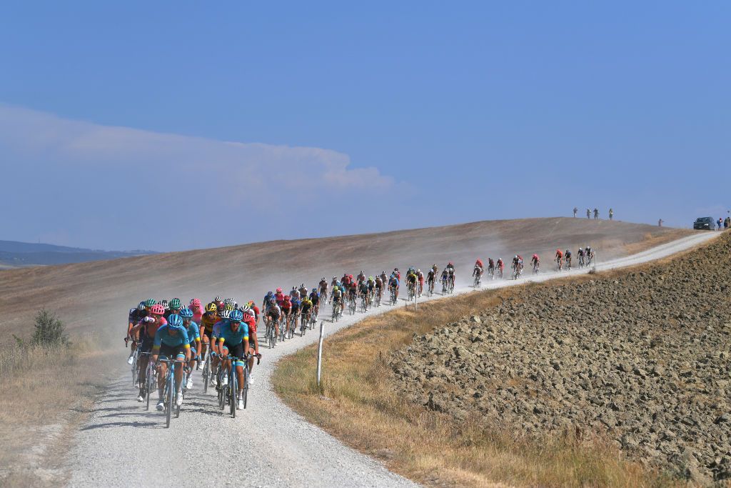 SIENA ITALY AUGUST 01 Hugo Houle of Canada and Astana Pro Team Jakob Fuglsang of Denmark and Astana Pro Team Manuele Boaro of Italy and Astana Pro Team Peloton Dust Gravel Strokes Landscape during the Eroica 14th Strade Bianche 2020 Men a 184km race from Siena to SienaPiazza del Campo StradeBianche on August 01 2020 in Siena Italy Photo by Tim de WaeleGetty Images