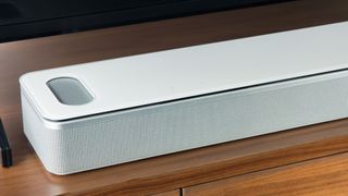 The Bose Smart Ultra Soundbar underneath a TV.