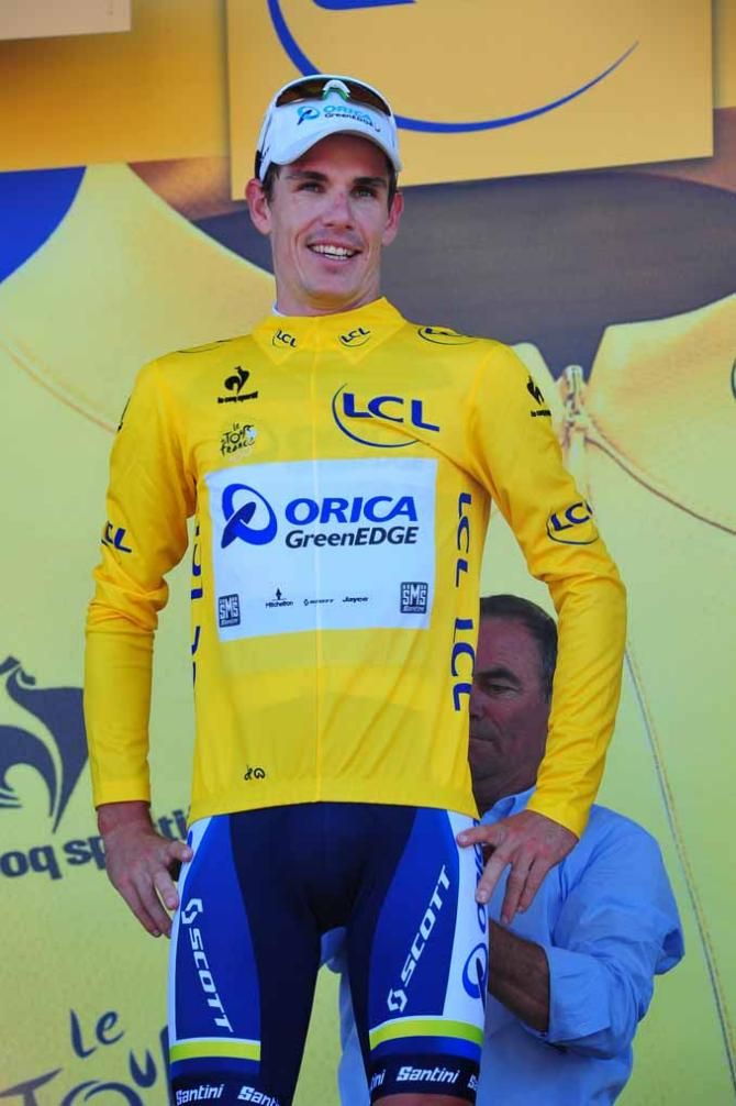 Daryl Impey (Orica-GreenEdge) takes hold of the maillot jaune.
