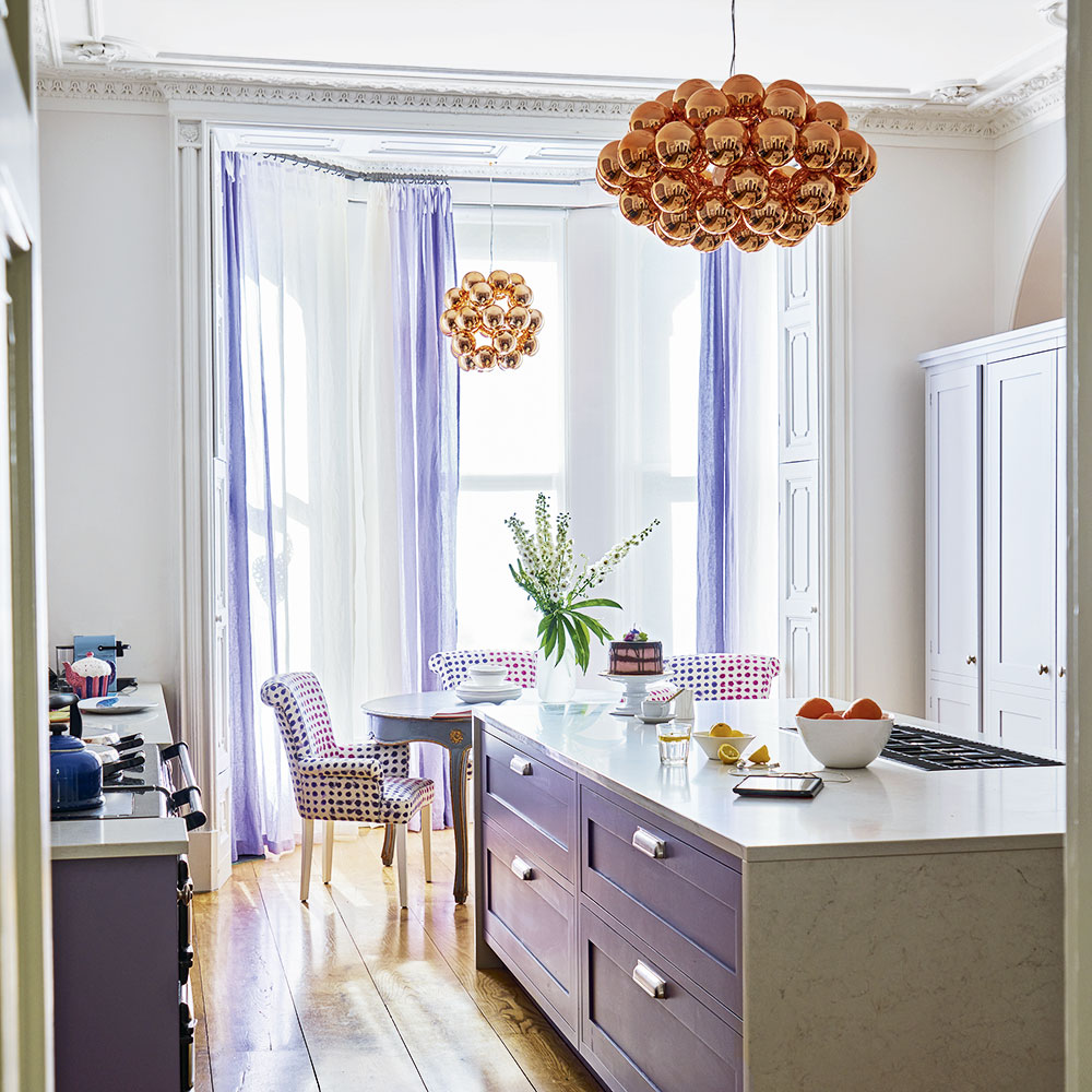 kitchen room with drawers and cabinets with curtains on window