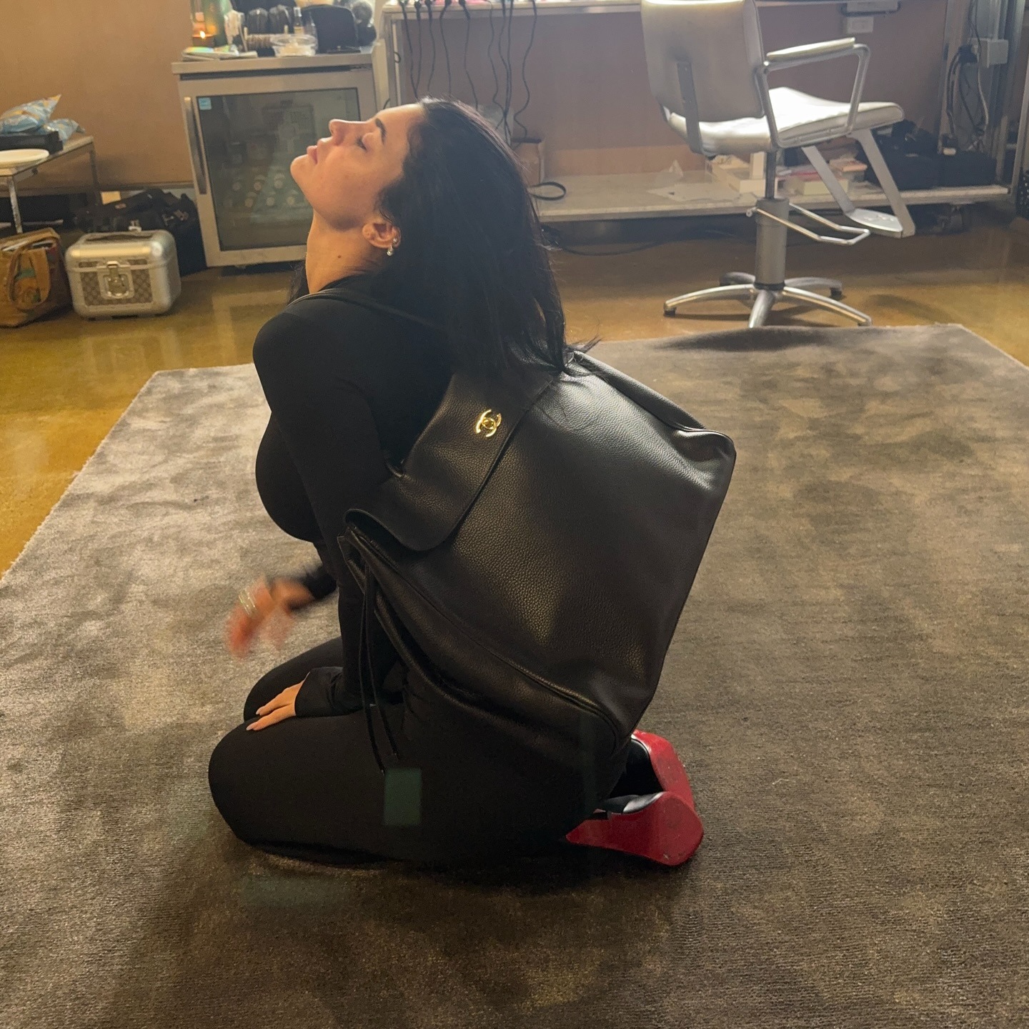 Kylie Jennifer wears the Chanel oversized bag with an all-black outfit.
