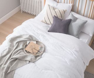 Night Lark duvet cover on a bed with wooden frame