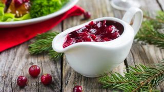 A serving dish filled with cranberry sauce