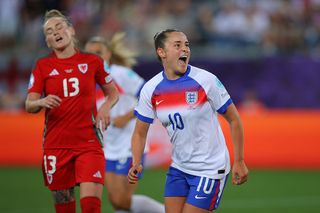 Ella Toone of England celebrates after scoring their second goal as Rachel Rowe of Wales reacts during the UEFA Women's EURO 2025 Group D match between England and Wales at Arena St. Gallen on July 13, 2025 in St Gallen, Switzerland.