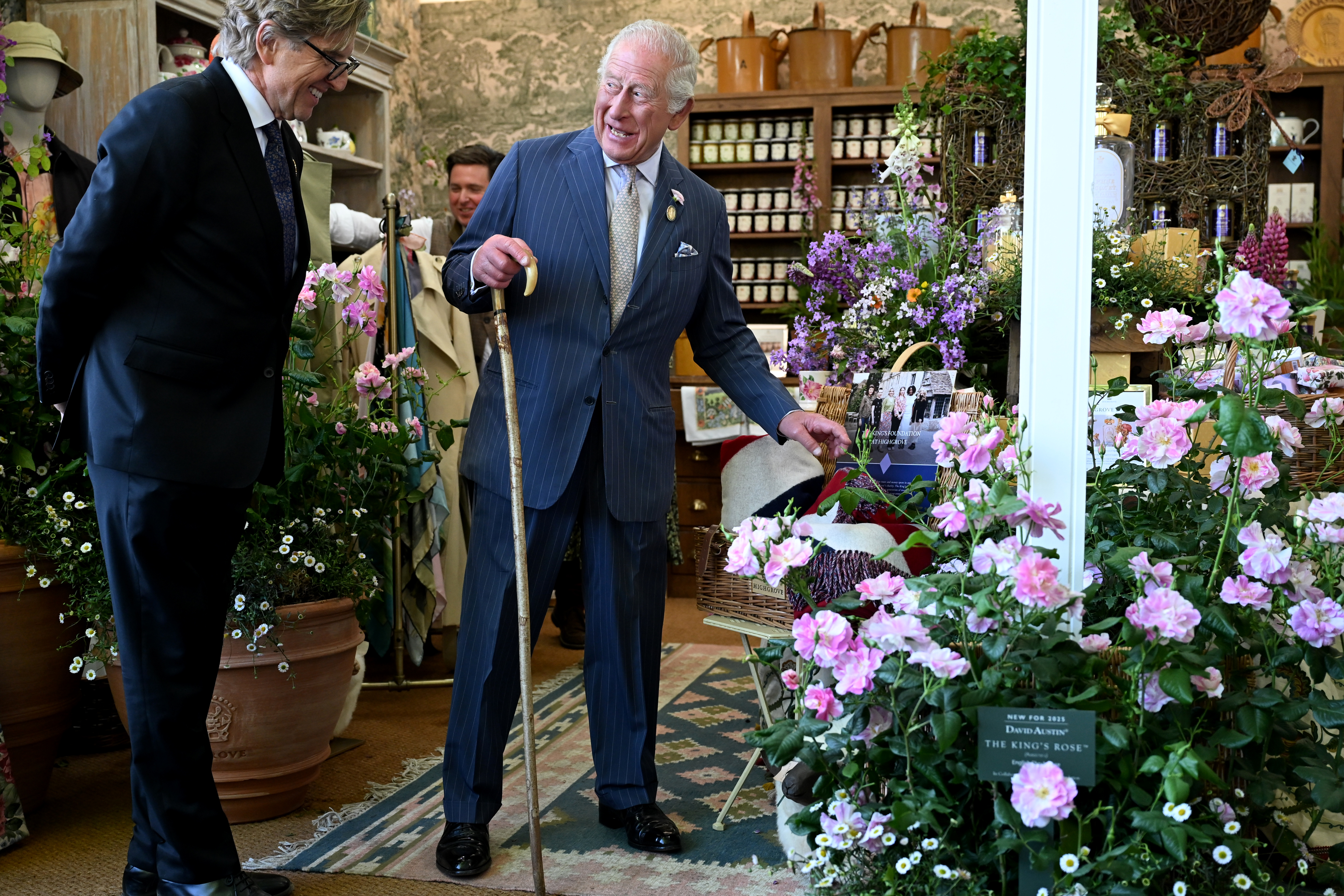King Charles in a booth at the Chelsea Flower Show