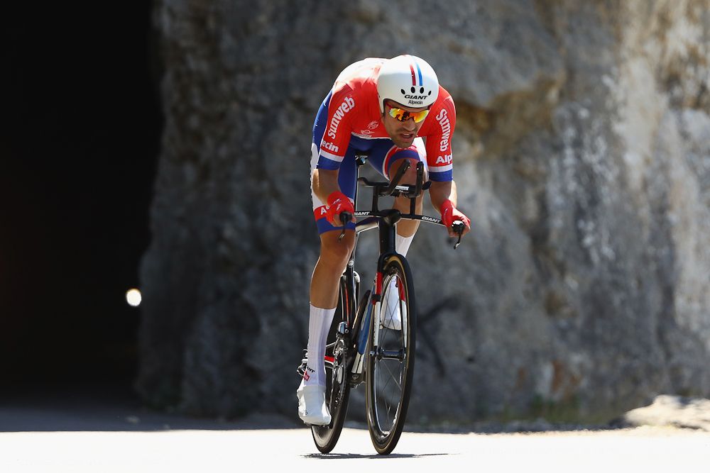 Tom Dumoulin rides to the win during Friday's stage 13 time trial.