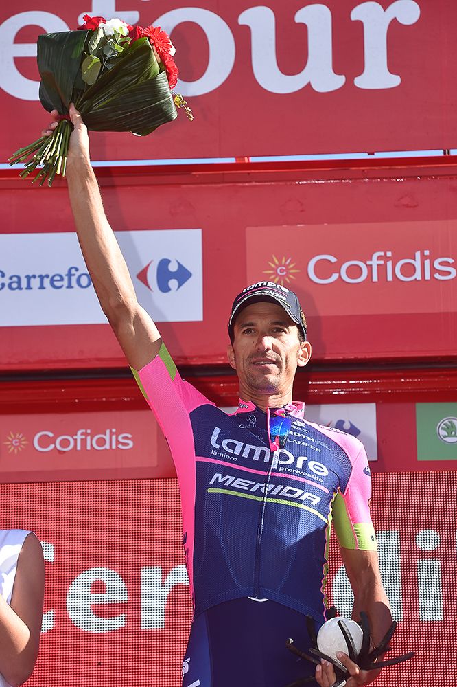 Ruben Plaza celebrates on the stage 20 podium.