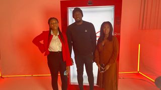 Two TechRadar Editors pose for photo with Usain Bolt for Virgin Media