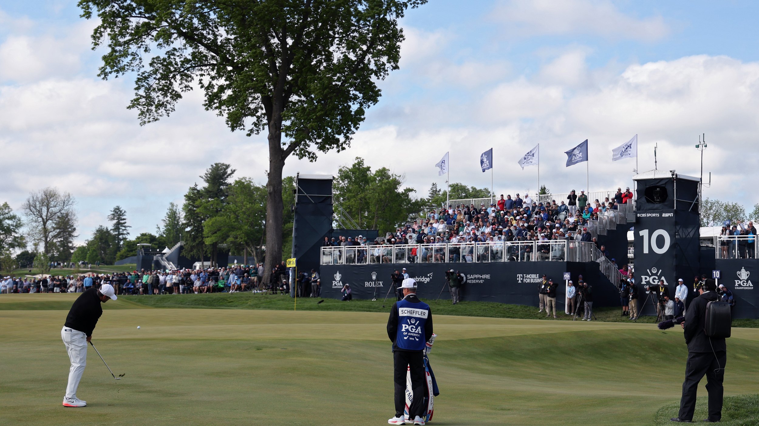 Scottie Scheffler plays a chip shot at the 2026 PGA Championship