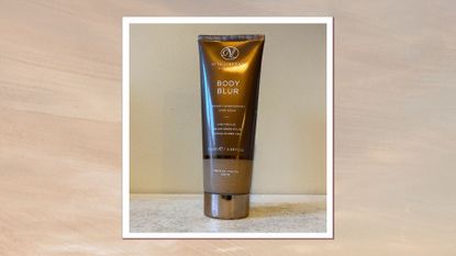 an image of vita liberata body blur on a limestone surface with a beige wall behind it and shadow