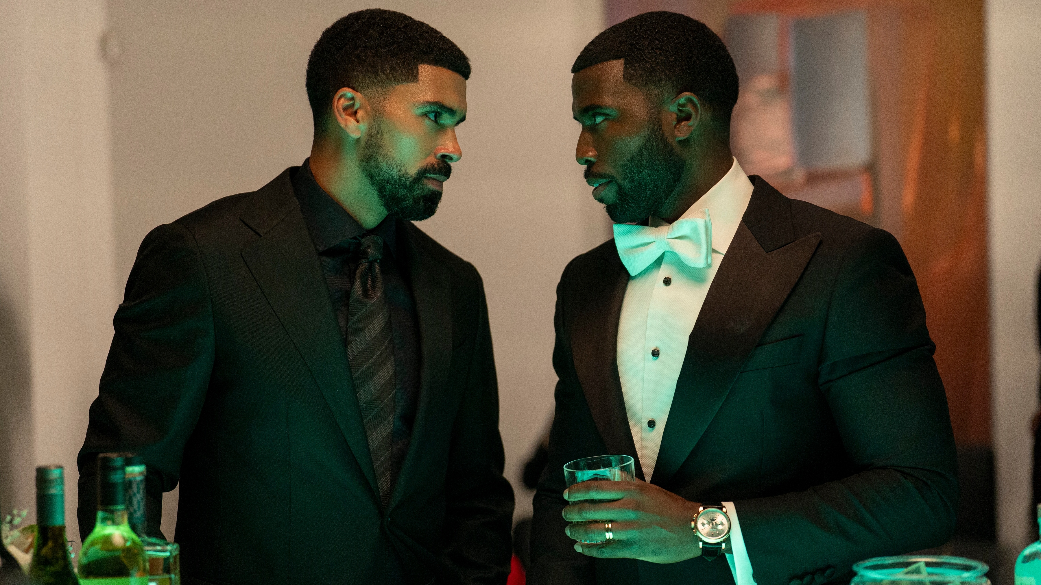 (L to R) Matthew Law as Isaiah Stiles and Y&amp;rsquo;lan Noel as Coltrane Wilder wearing suits.